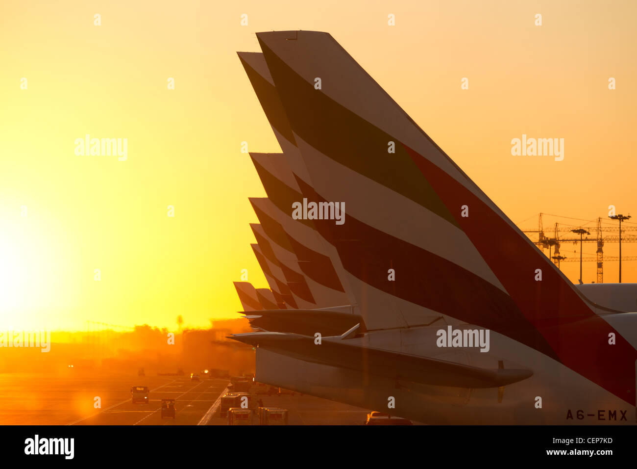 Dubai Airport, Dubai (UAE) - 23 December, 2011:  A Row of Emirates International Airlines planes with Emirates logo on the tail. Stock Photo