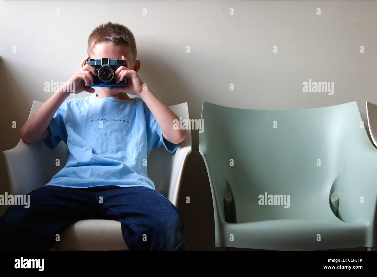 Young Boy with Camera Stock Photo