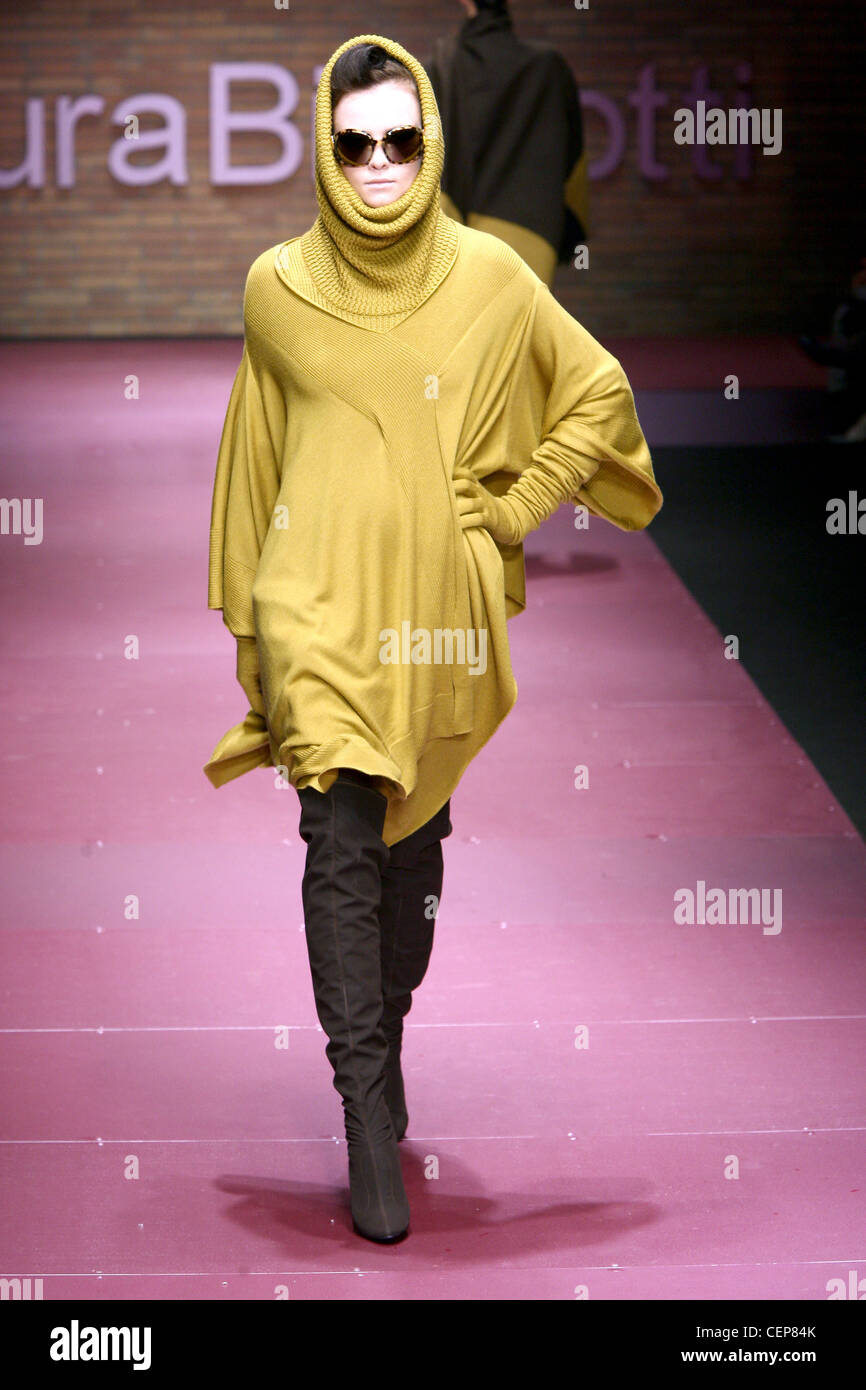 Laura Biagiotti Milan Ready to Wear Autumn Winter Hooded mustard colour hooded dress, sunglasses, and brown thigh boots Stock Photo - Alamy Laura Biagiotti Milan Ready to Wear Autumn Winter Hooded mustard colour hooded dress, sunglasses, and brown thigh boots Stock Photo - Alamy