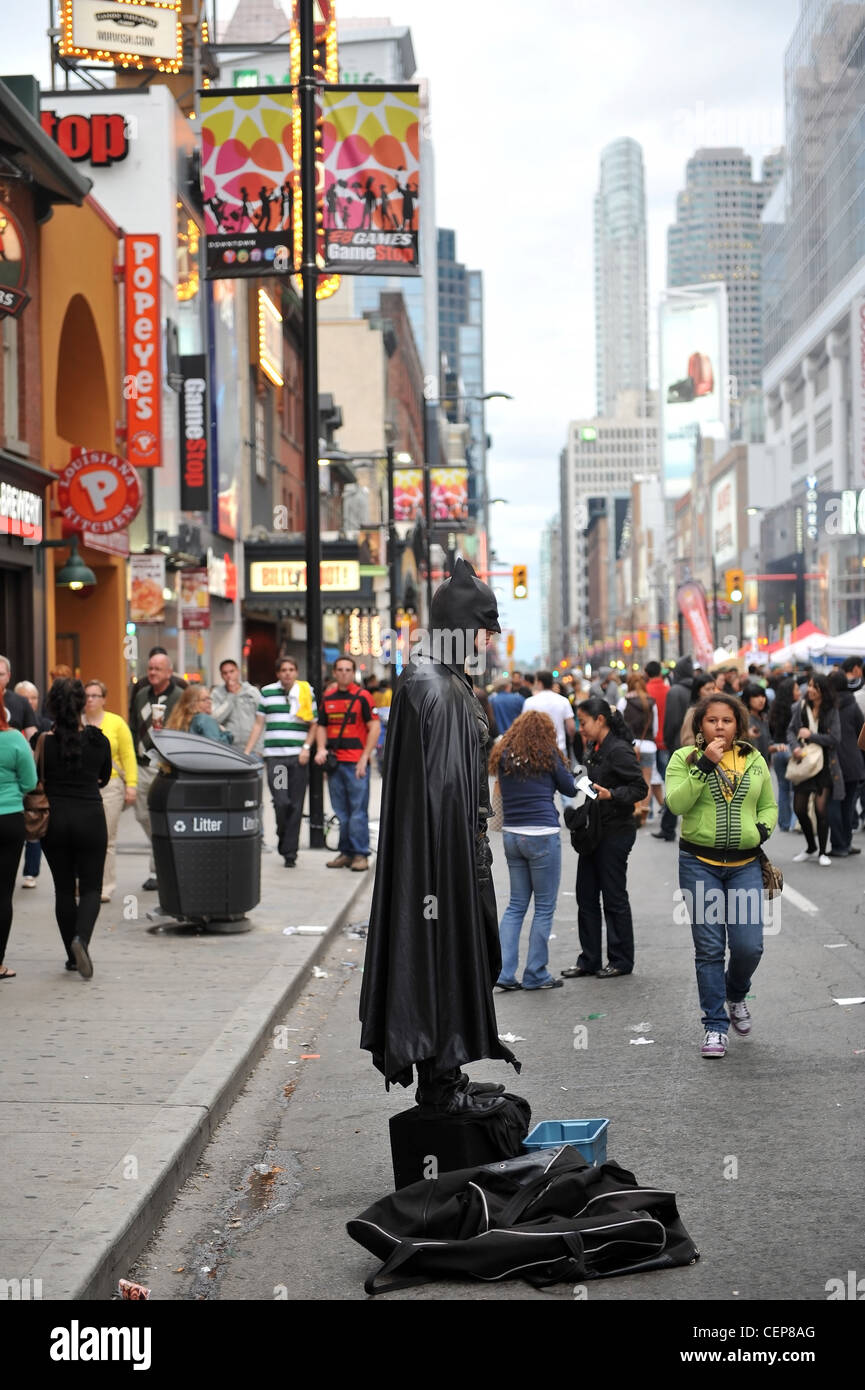 The busker known as Toronto Batman on Yonge St in Toronto Stock Photo