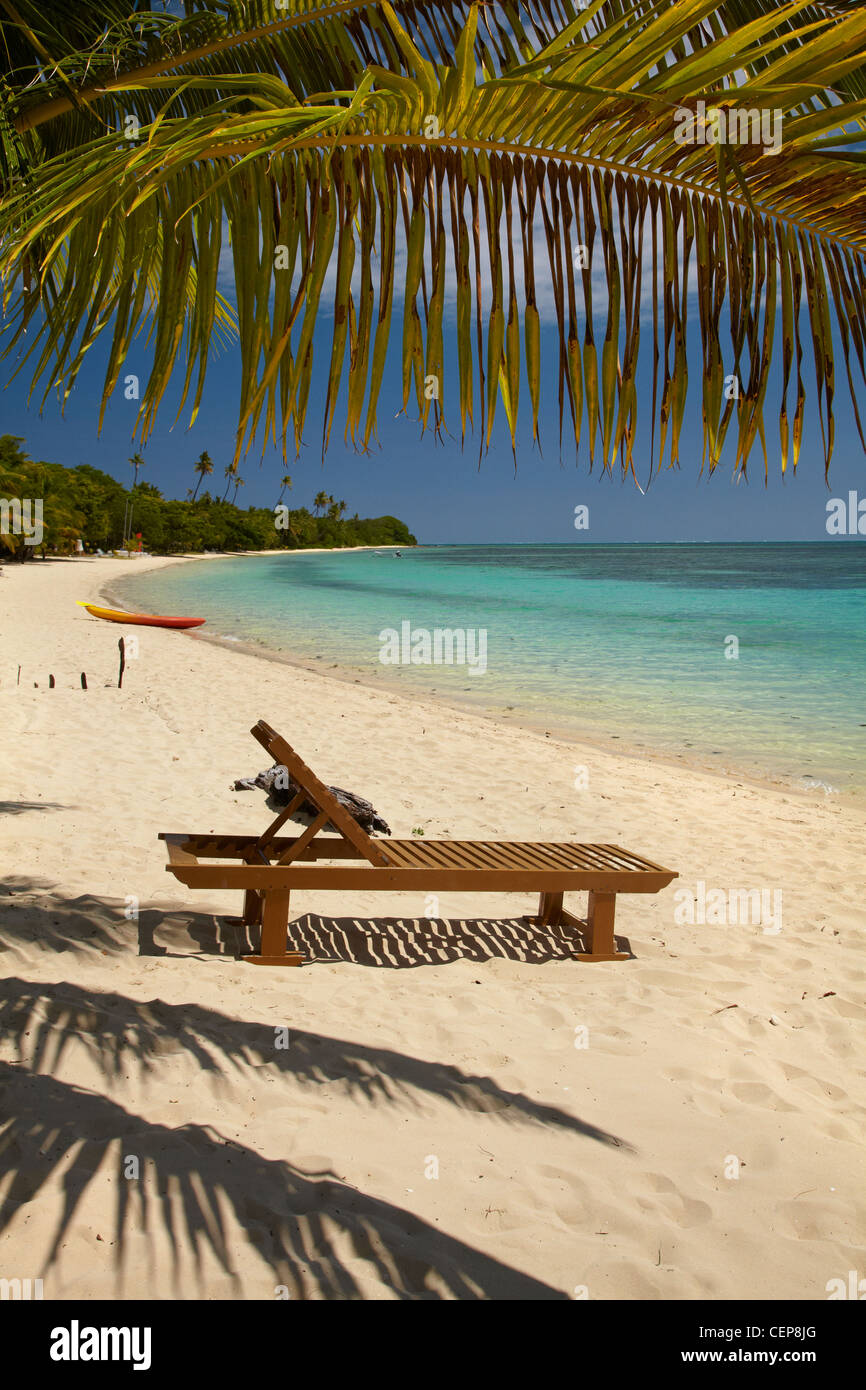 Beach, palm trees and lounger, Plantation Island Resort, Malolo Lailai Island, Mamanuca Islands, Fiji, South Pacific Stock Photo