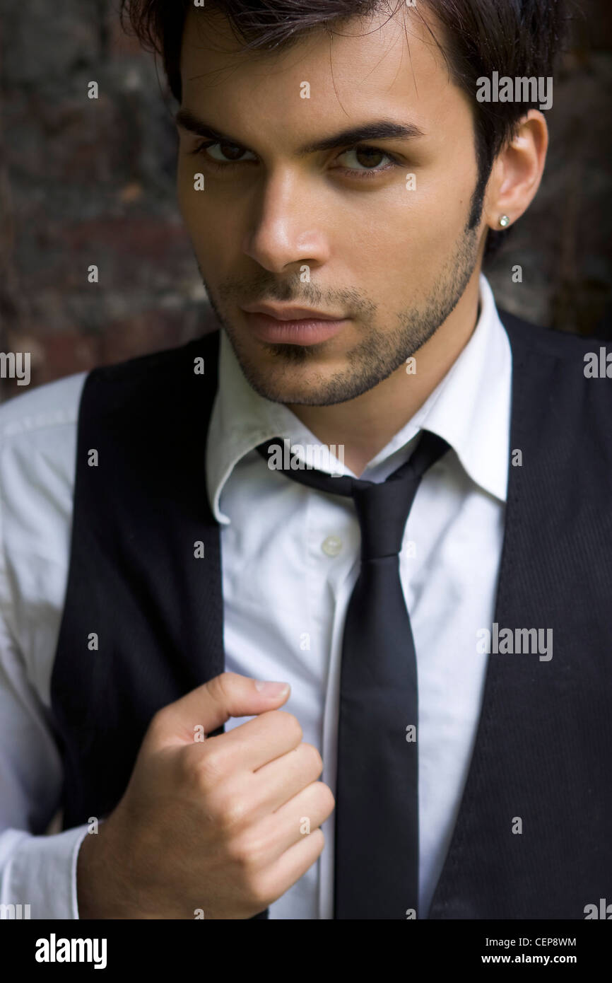 Male brunette hair and stubble, wearing 