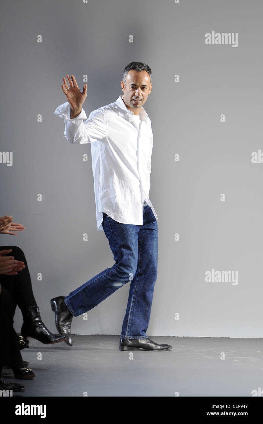 Calvin Klein New York Ready to Wear Spring Summer Fashion designer Francisco Costa wearing jeans, white shirt and black shoes Stock Photo