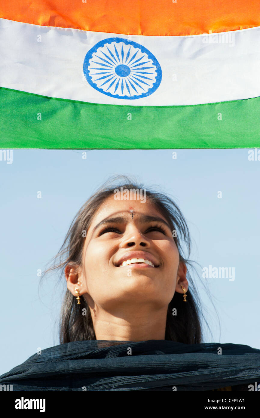 Happy Indian teenage girl holding an Indian flag Stock Photo Alamy