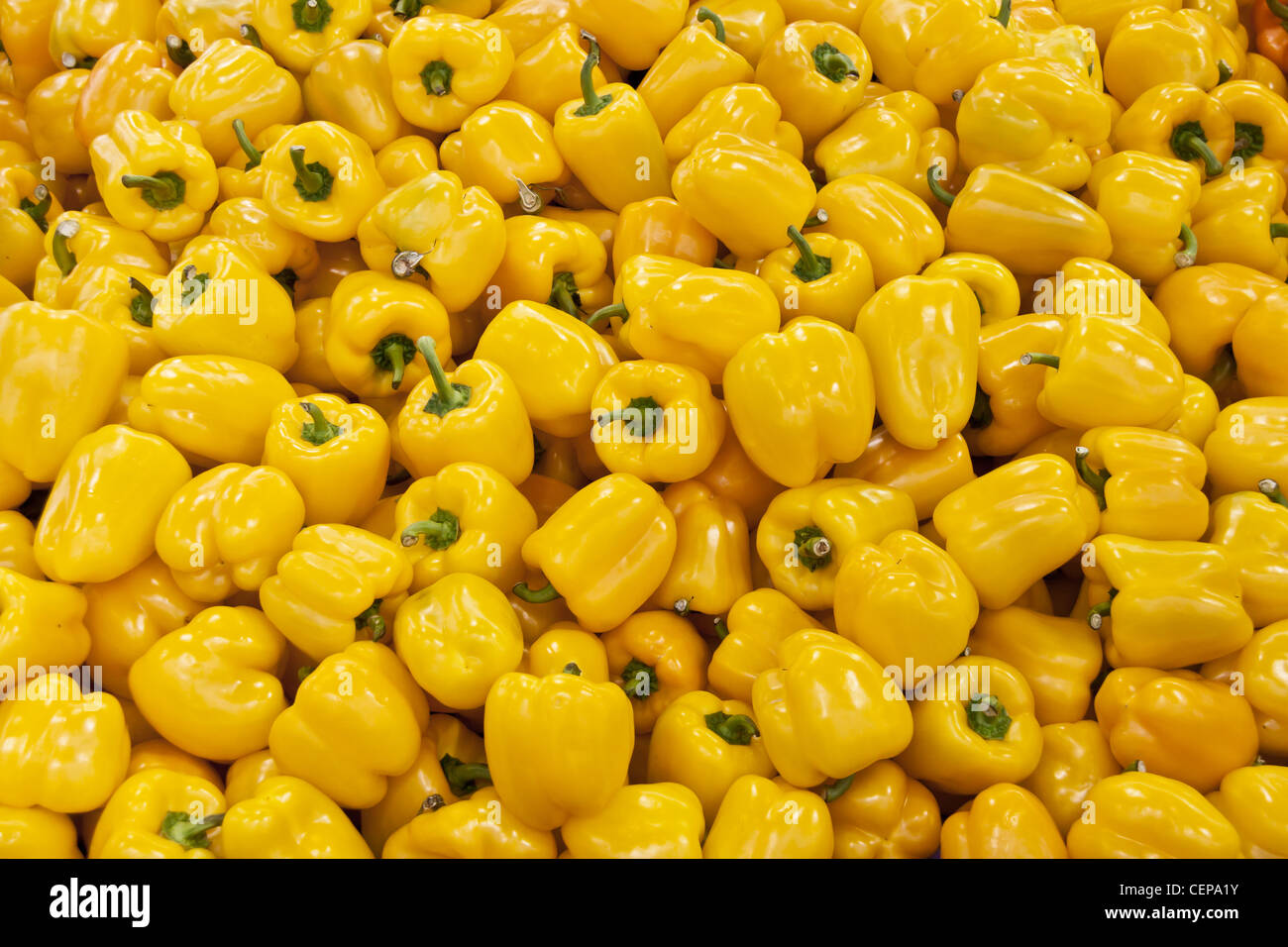 Yellow peppers raw background Stock Photo Alamy