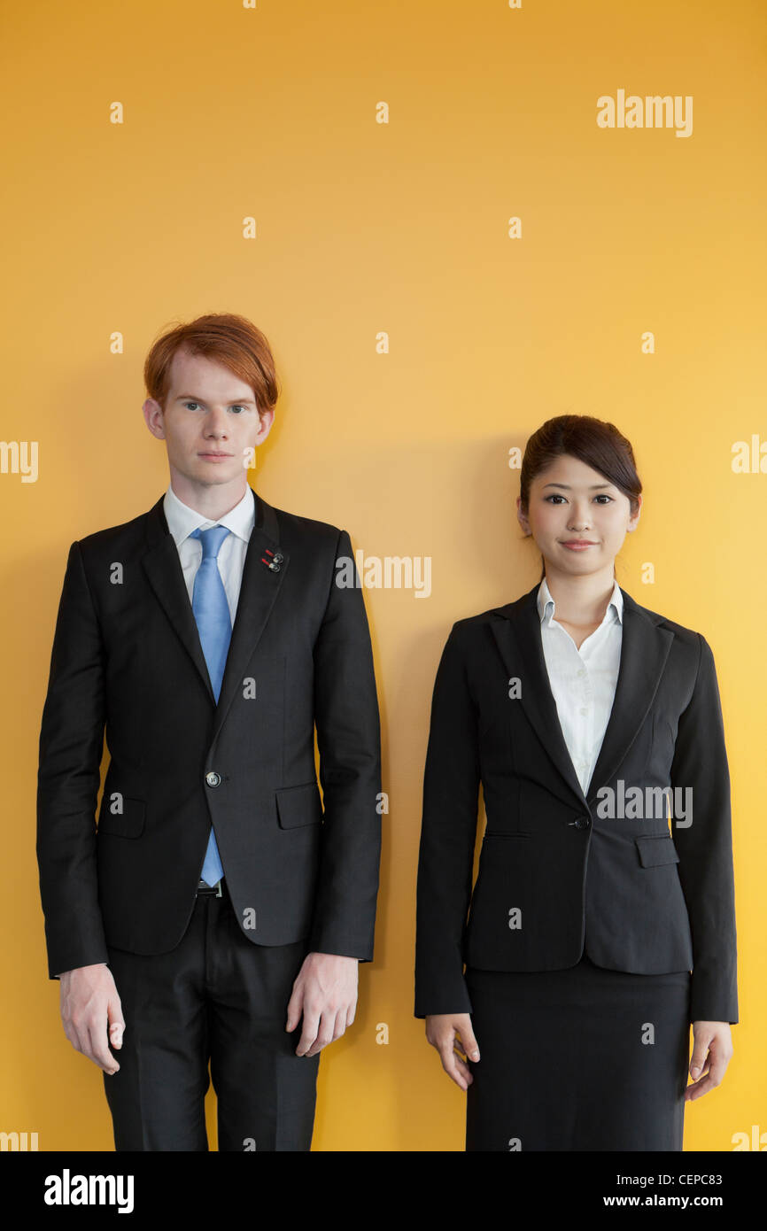Businessman and businesswoman standing side by side Stock Photo - Alamy