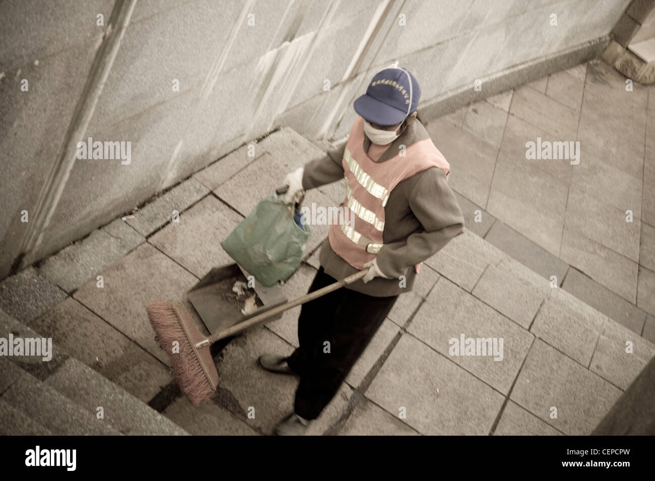 Young Woman Sweeping Up Garbage; Guangxi Zhuang,China Stock Photo