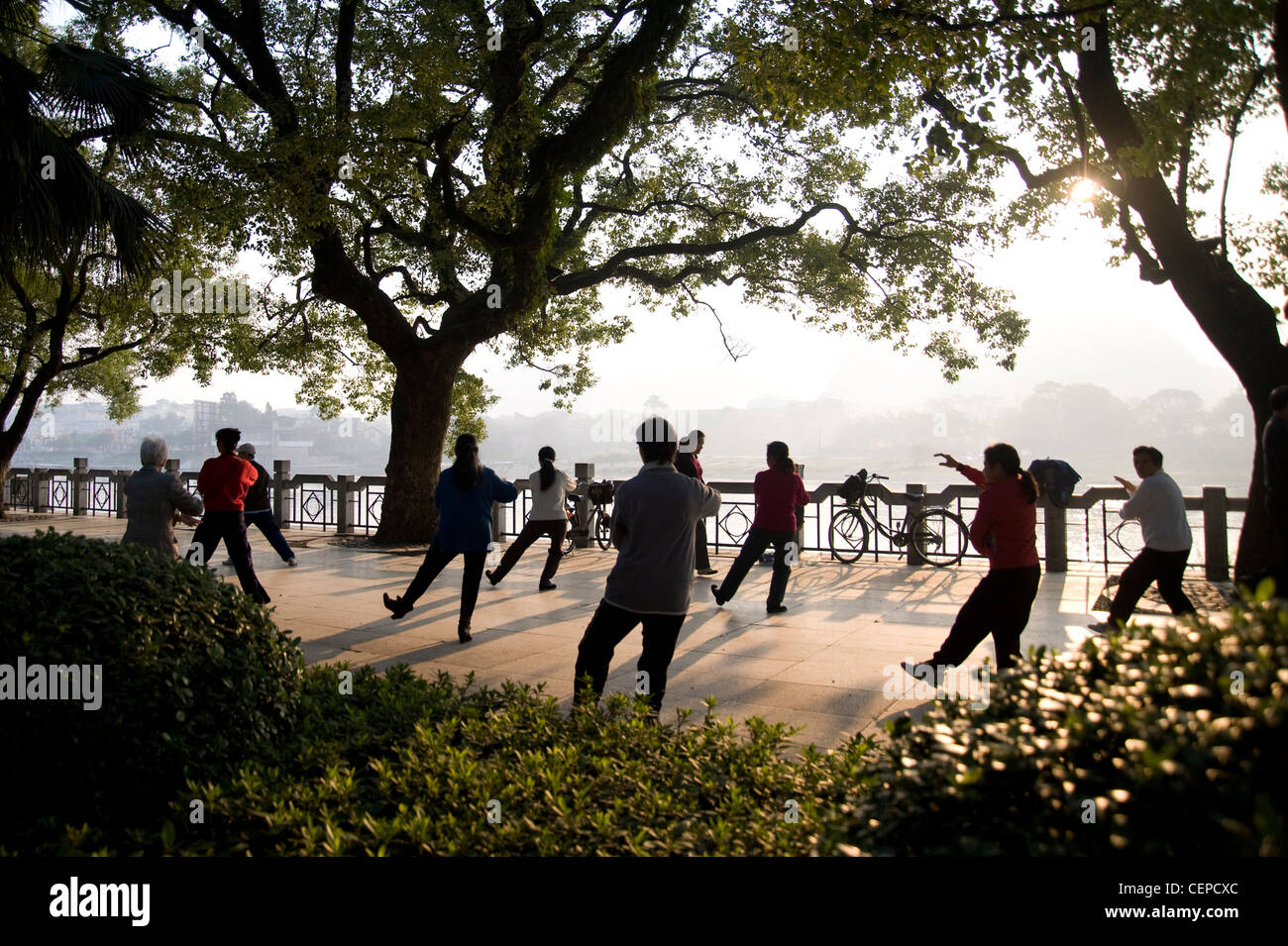 People In A Public Park Doing Tai Chi; Guangxi Zhuang,China Stock Photo