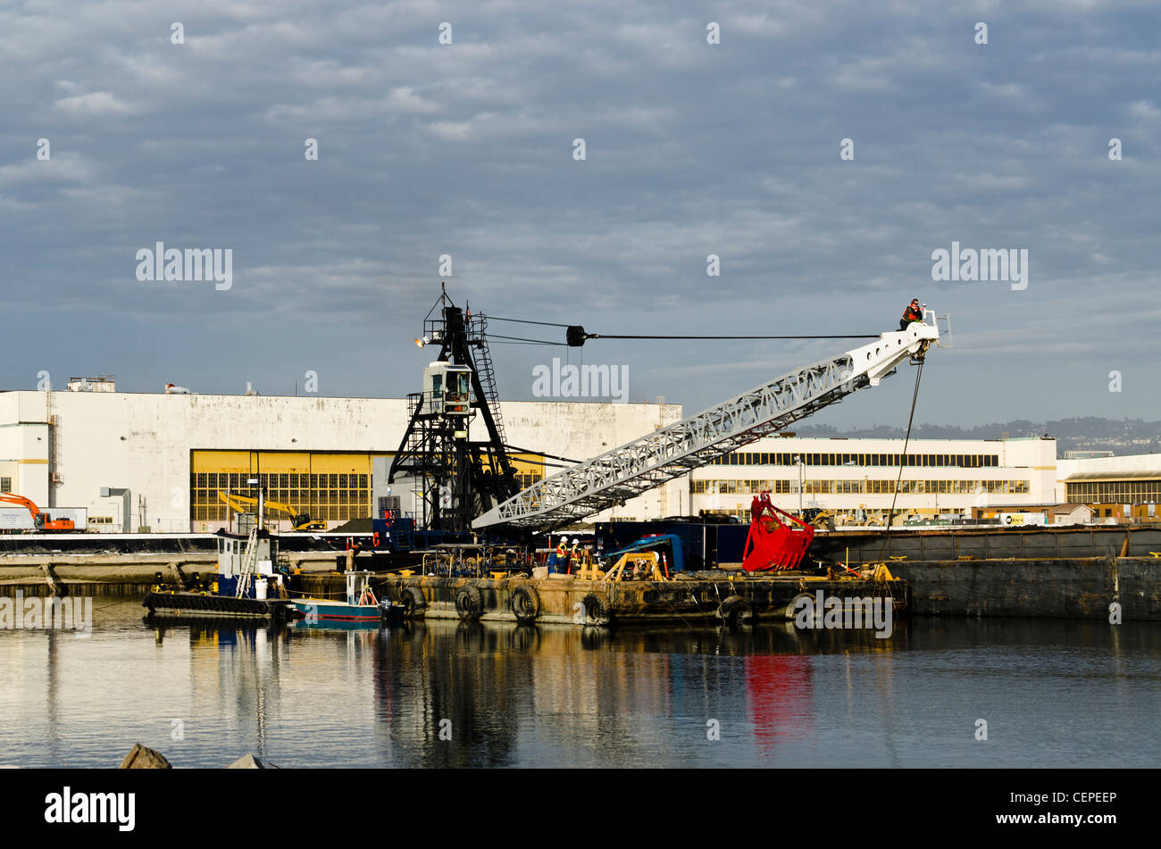 Dredge barge being repaired in the Seaplane Lagoon at the Naval Air