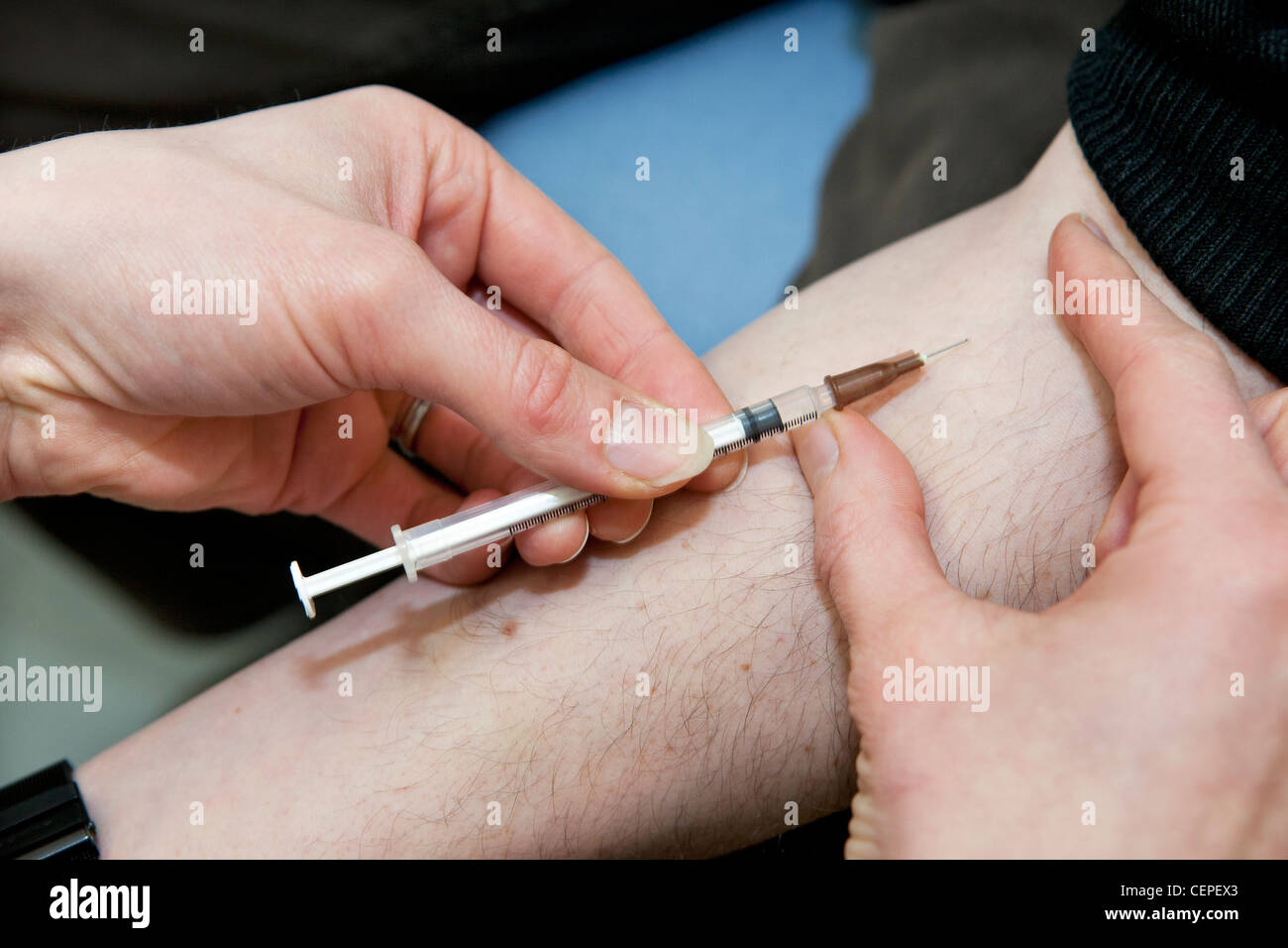 Hypodermic needle injection Stock Photo