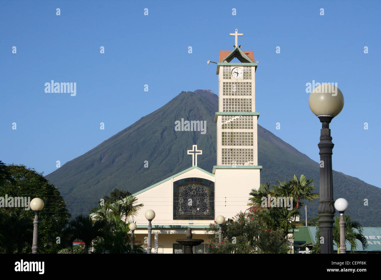 La Fortuna's Catholic Church, With Arenal Volcano In Background Stock