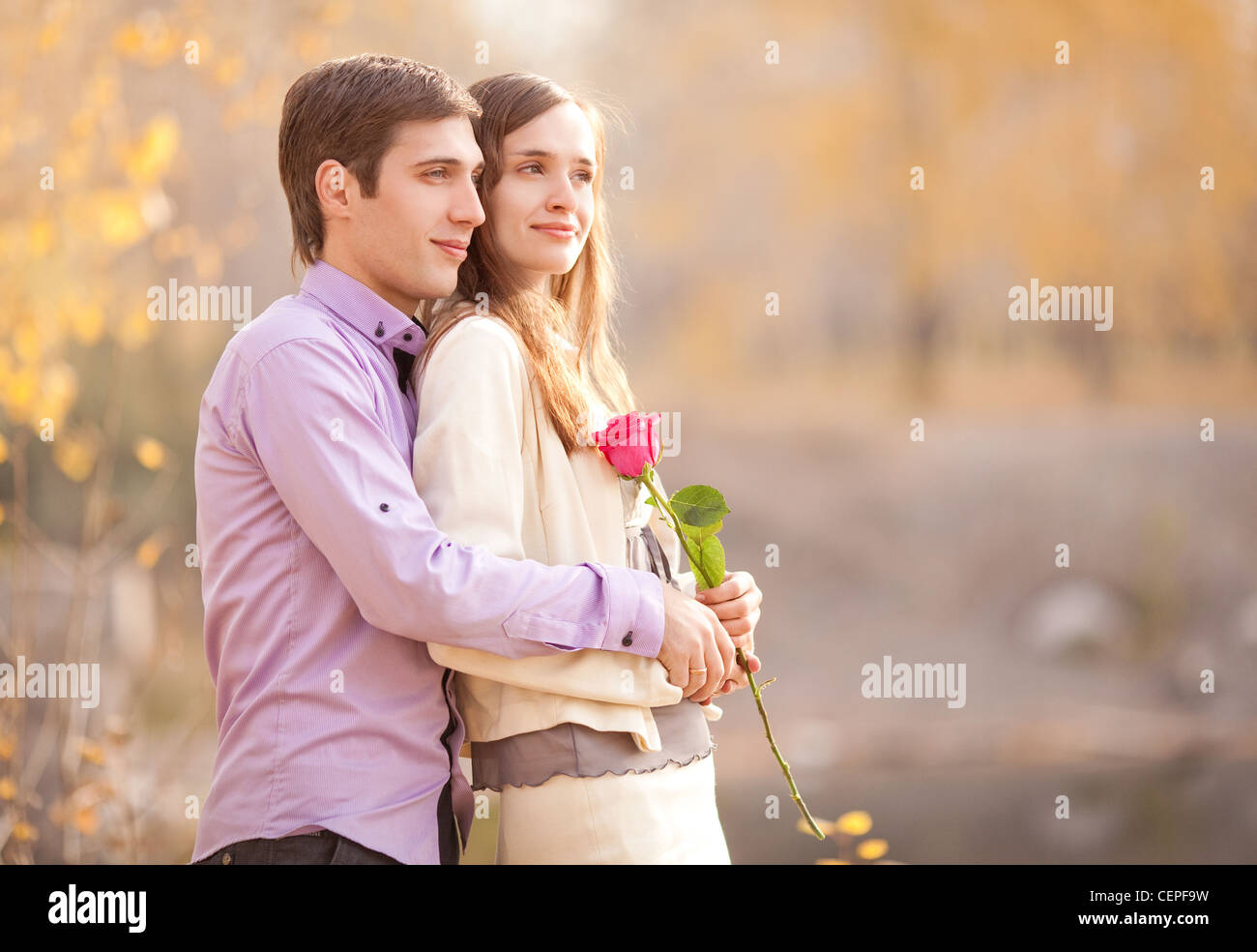 happy young couple in the autumn park Stock Photo - Alamy