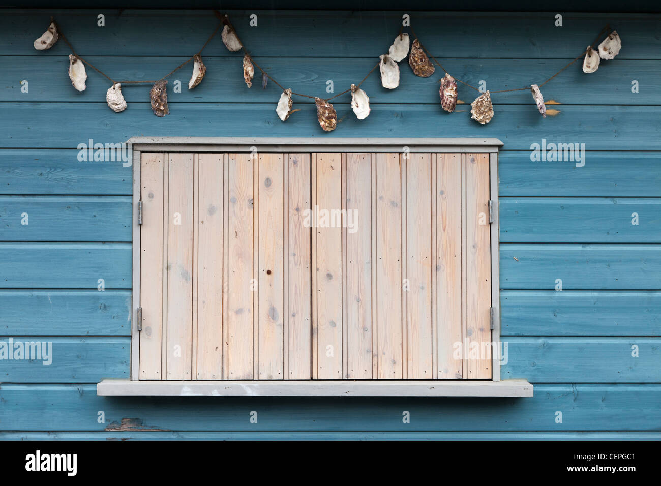 a window closed with wooden shutters; inverary, argyl, scotland Stock Photo