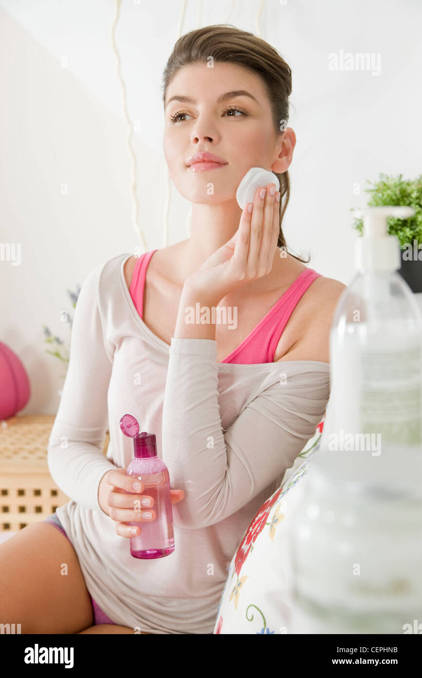 Woman cleansing oil face hi-res stock photography and images - Alamy