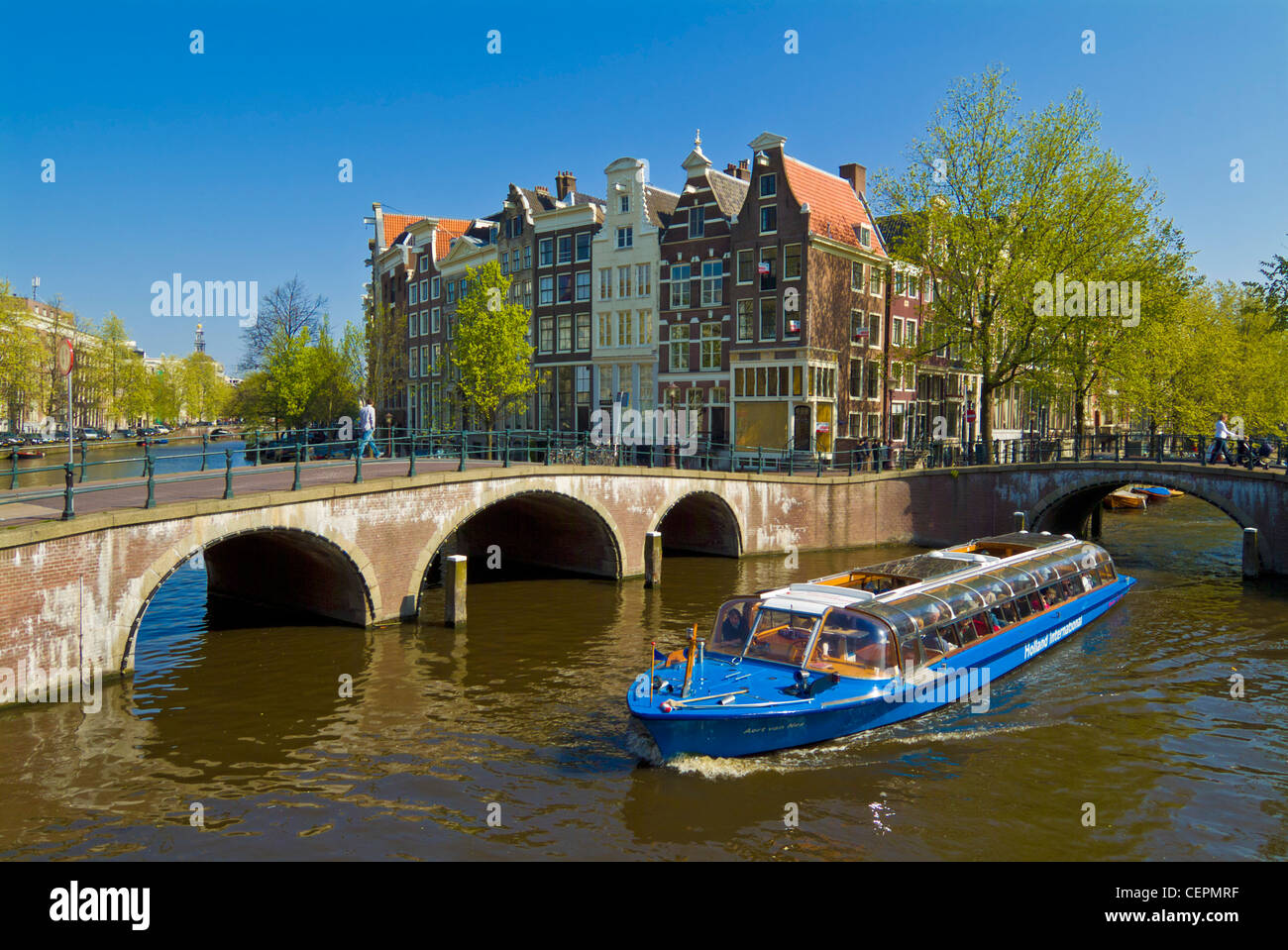 Cruise boat on the Keizersgracht canal in central Amsterdam Holland Netherlands EU Europe Stock Photo
