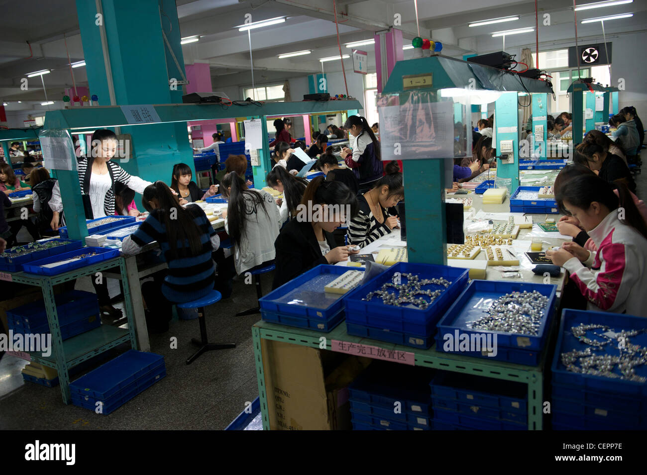 Employees make fashion jewelry in Zhejiang Neoglory Jewelry Co., Ltd