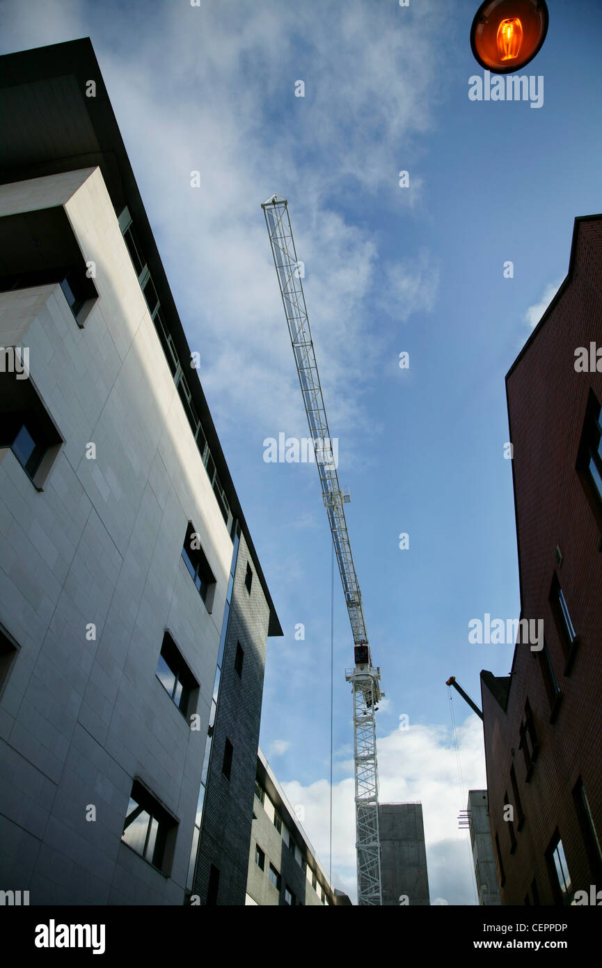 A central street scene in Belfast with blue skies and a crane above. Stock Photo