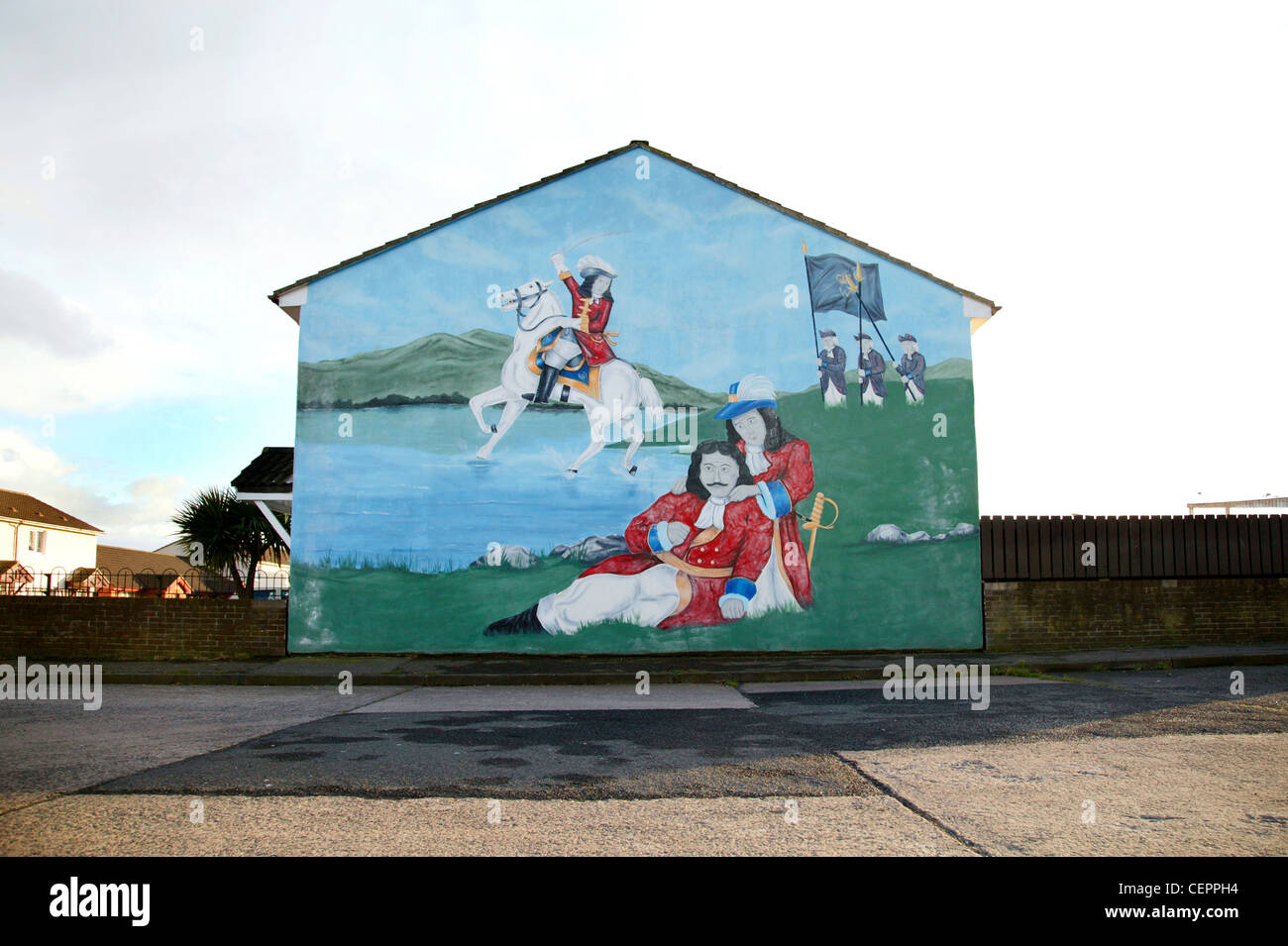 An historical political mural on the side of a building in Shankill Parade. Stock Photo