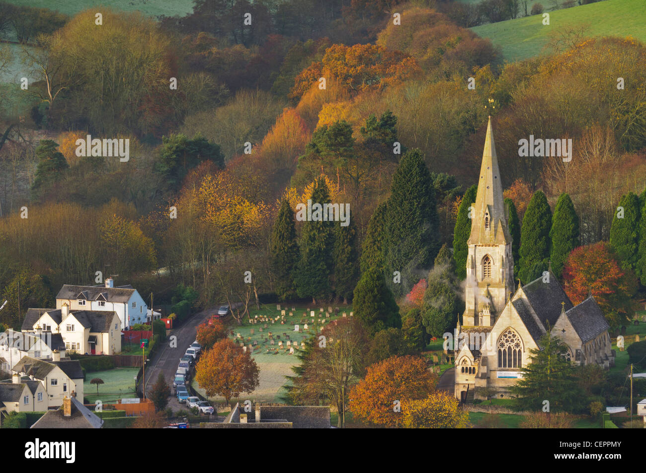 View across Nailsworth Valley towards Woodchester St Mary Church from Rodborough Common, early morning in autumn near Stroud Stock Photo