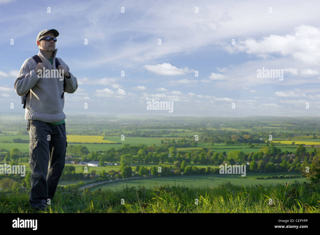 A man carrying a rucksack on his back, hiking in the Chiltern Hills. Stock Photo