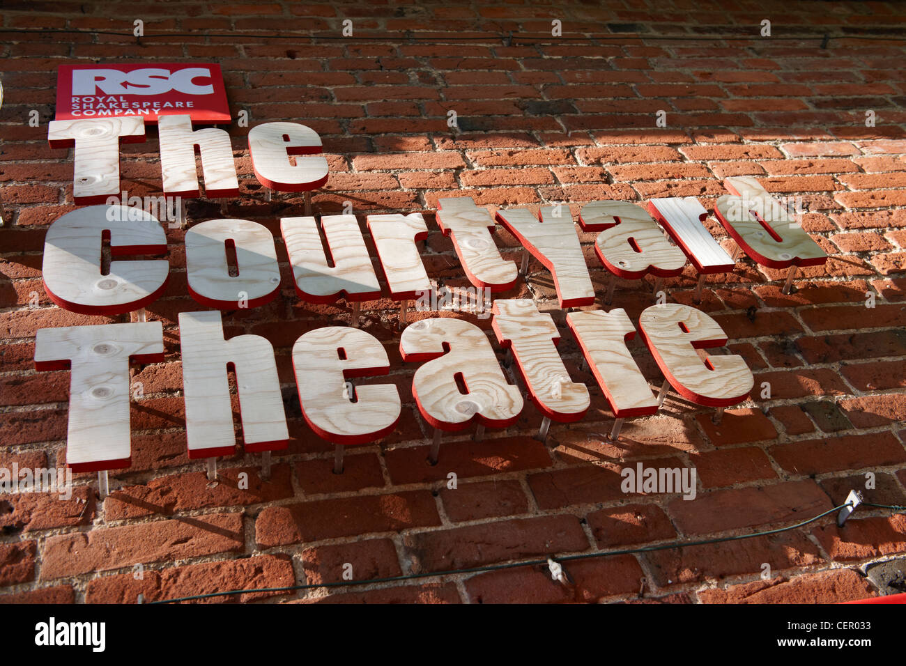 The Courtyard Theatre signage on a wall outside the building. The Courtyard Theatre, the RSC's (Royal Shakespeare Company) new t Stock Photo