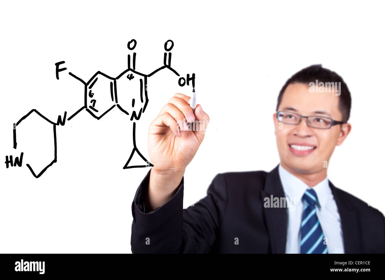 young teacher drawing a Chemical formula graph Stock Photo