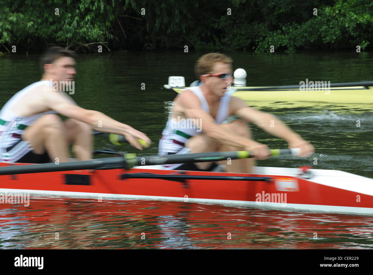 A boat crew rowing hard during a race at the annual Henley Royal ...
