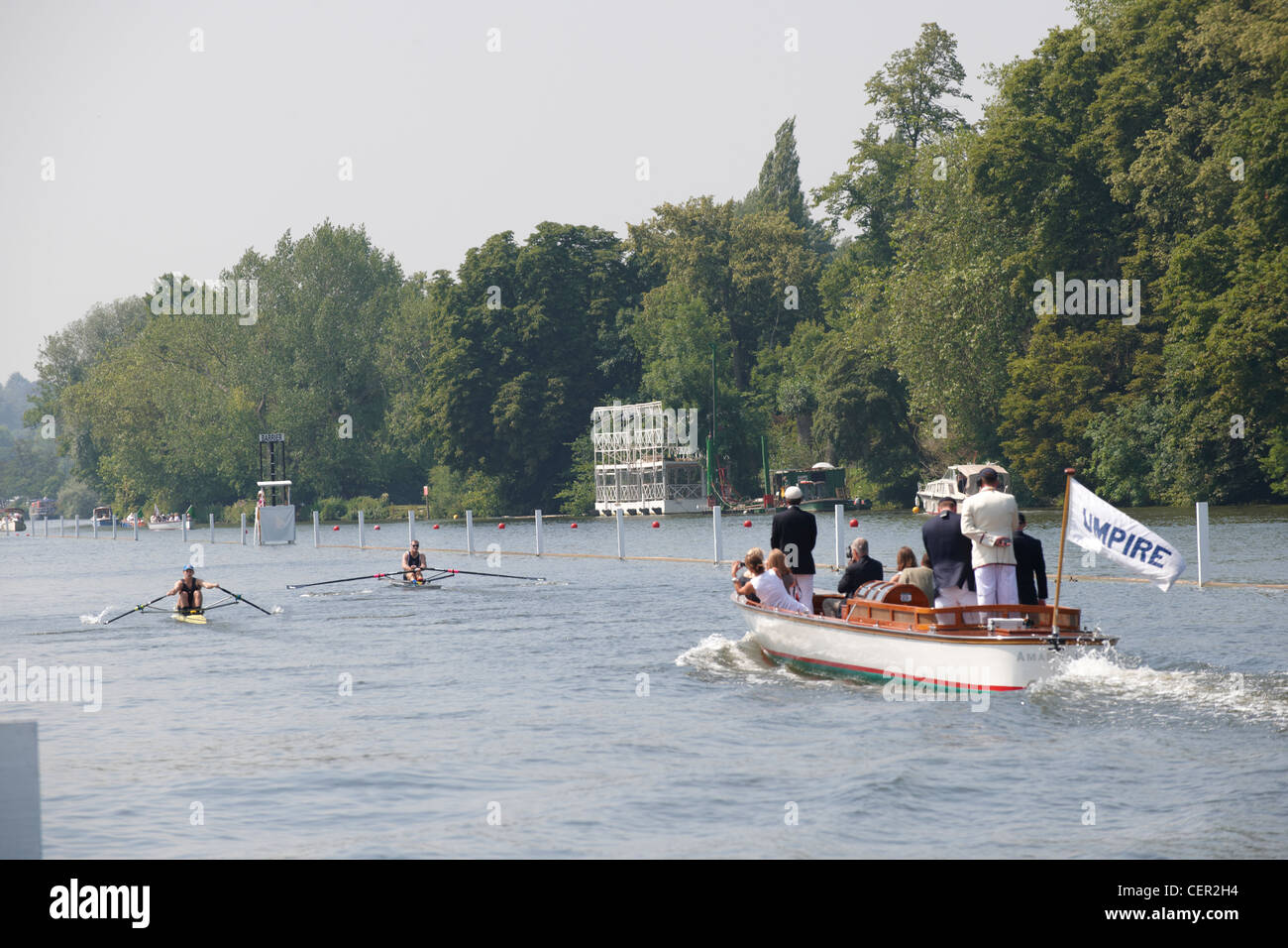 The umpire's boat following a race up the course at the annual Henley Royal Regatta. Stock Photo