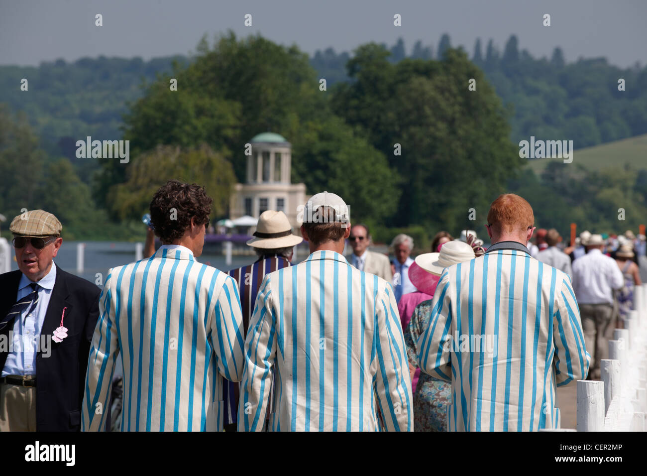 Rowing club members and spectators making their way along the riverside path at the annual Henley Royal Regatta. Stock Photo