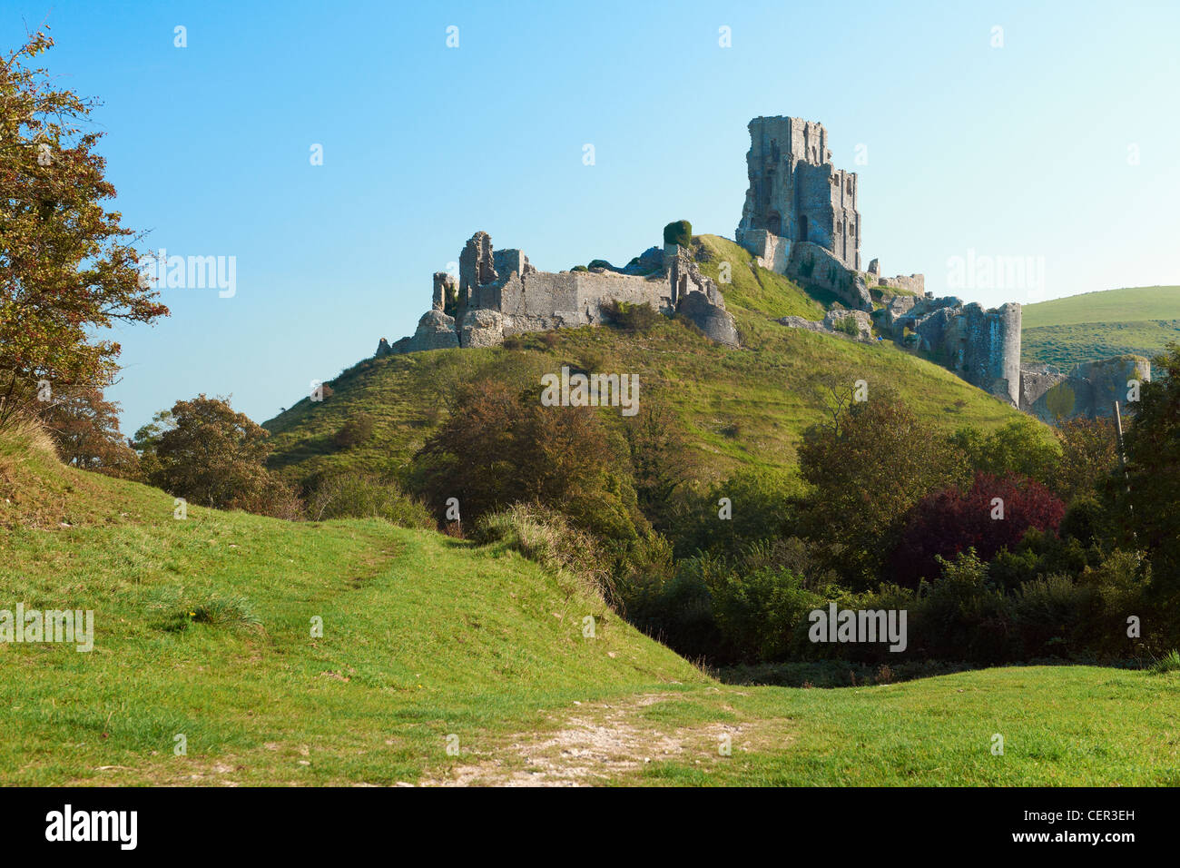 The ruins of the 11th century Corfe Castle in the Purbeck Hills. Stock Photo