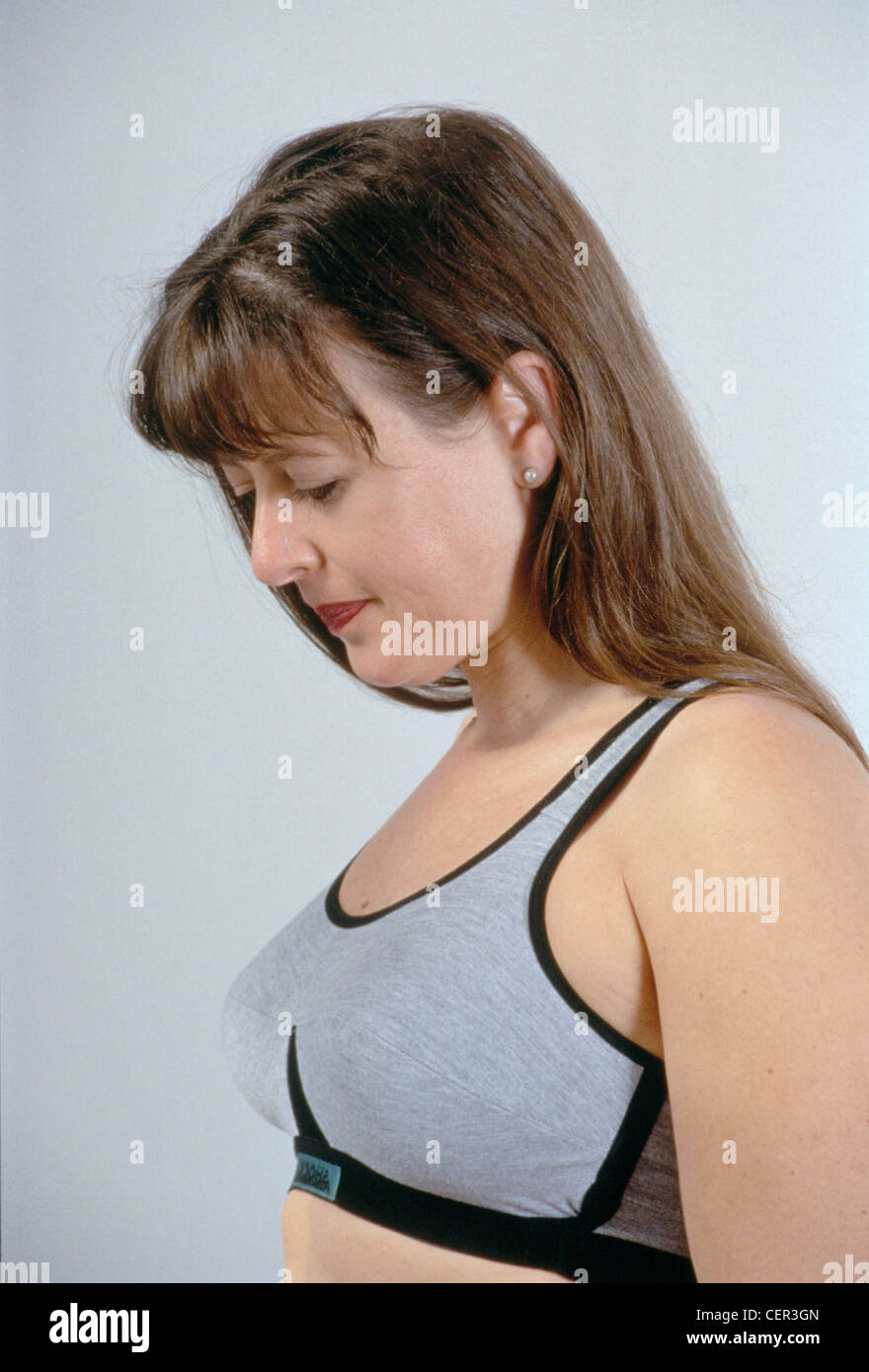 Brunette woman wearing black bra hi-res stock photography and images - Alamy