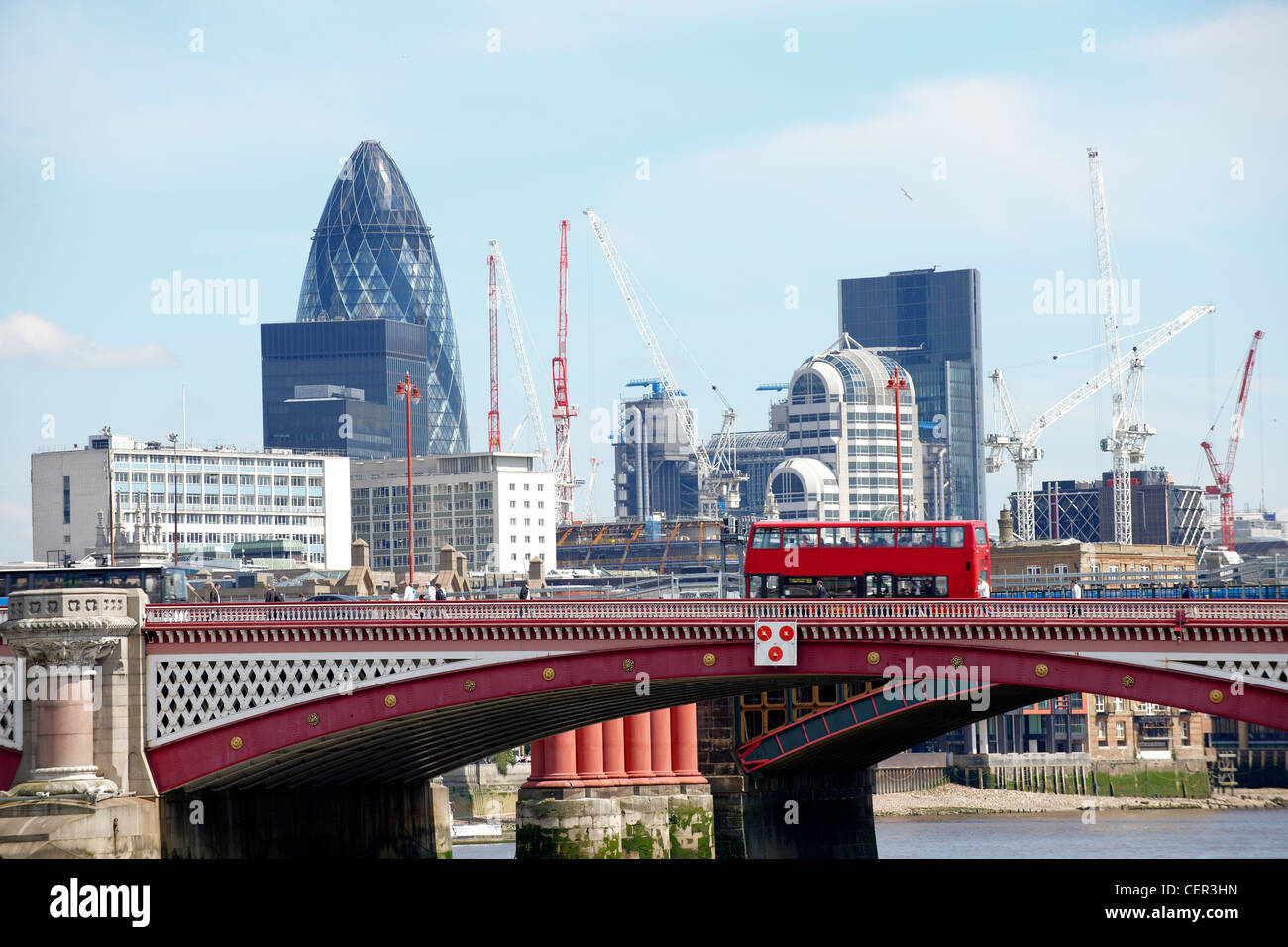 View of Blackfriars Bridge with a red bus and the City of London providing the backdrop. Stock Photo