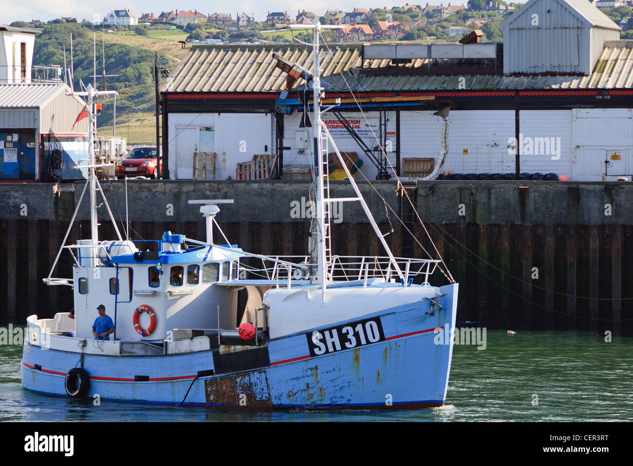 fishing boat entering scarborough harbour Stock Photo - Alamy