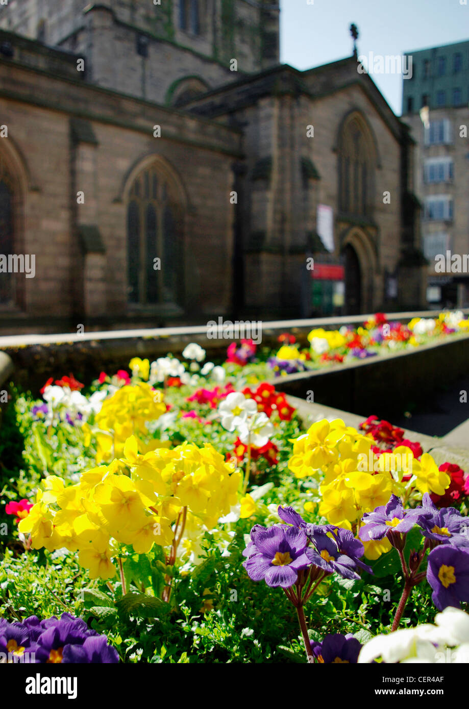 Bright coloured flowerbeds in front of St. Nicholas' Cathedral. Stock Photo