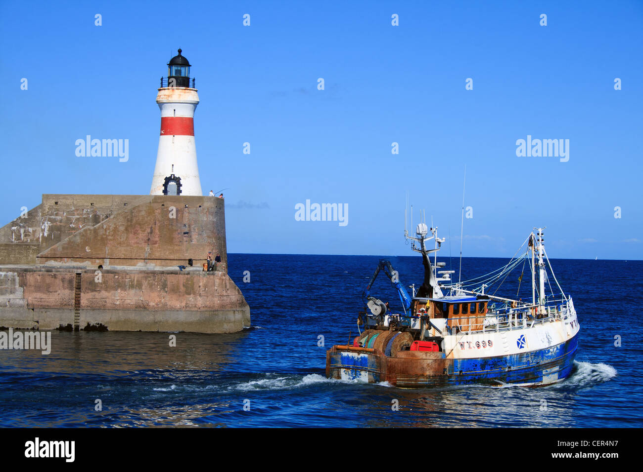 fishing  boat leaving fraserburgh harbour Stock Photo