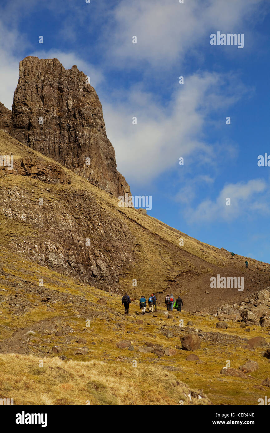 A group of walkers work their way up the Quiraing beneath the Prison on the Trotternish peninsula. Stock Photo