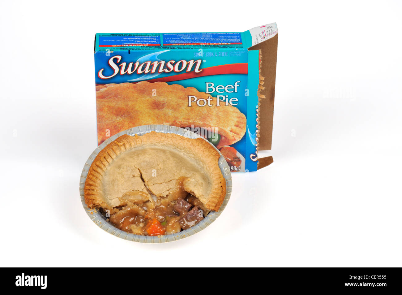 Cooked Swanson beef pot pie tv dinner in front of packaging on white background cut out. Stock Photo