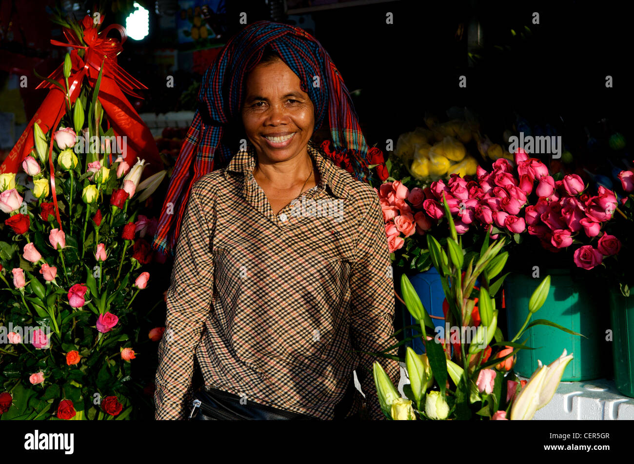 Khmer Flower (rose) vendor wearing krama (traditional Cambodian scarf), Phnom Penh, Cambodia