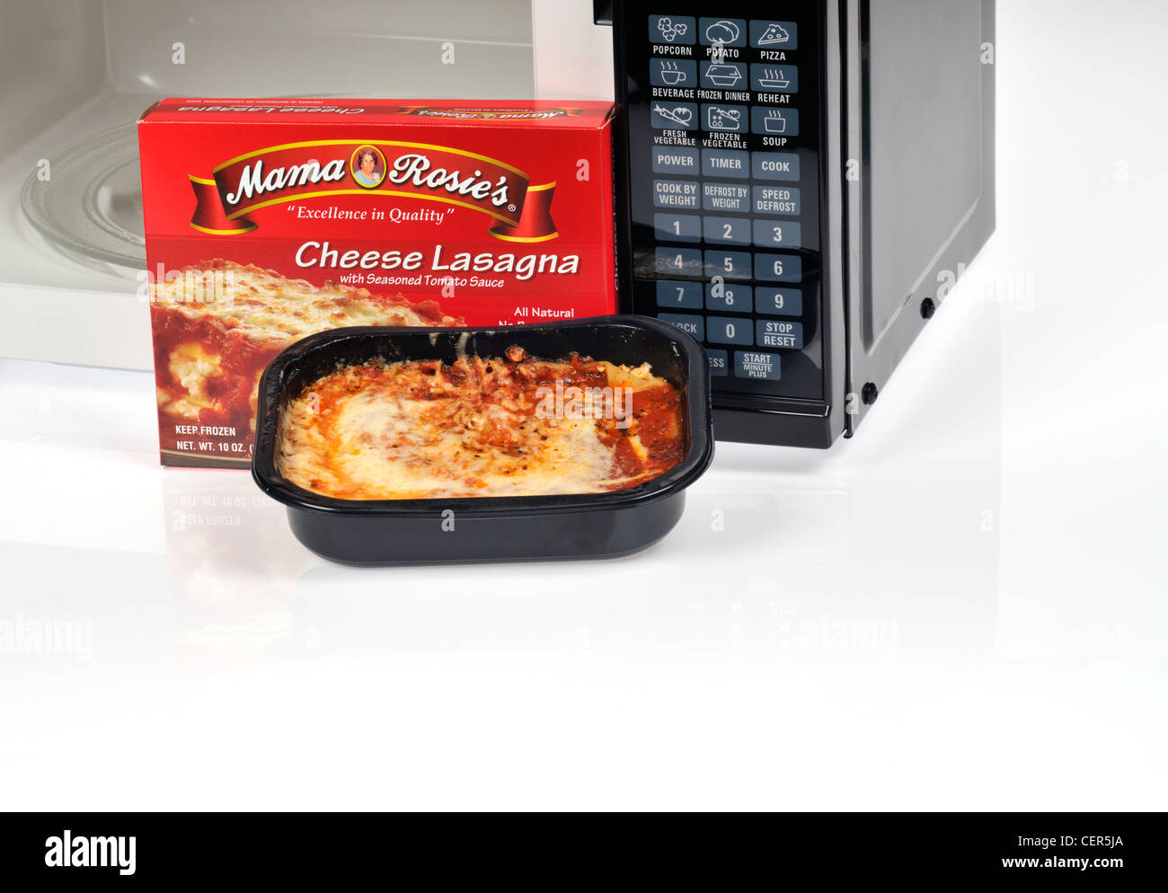 Cooked ready meal of Mama Rosie's frozen cheese lasagna dinner with microwave    open USA Stock Photo
