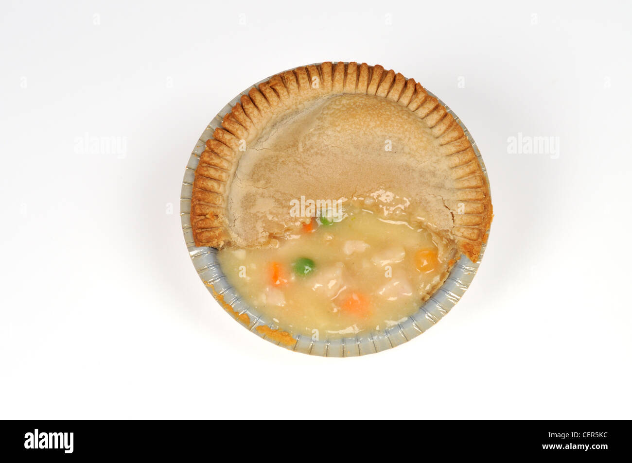 Chicken pot pie in aluminum tin on white background cut out. Stock Photo