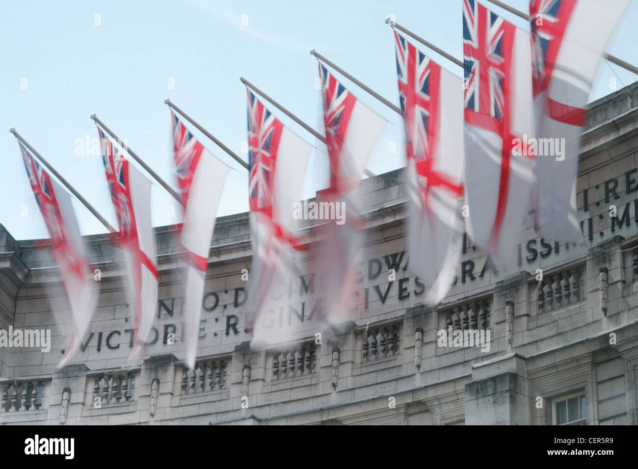 Flags in the breeze at Admiralty Arch near to Buckingham Palace. Stock Photo