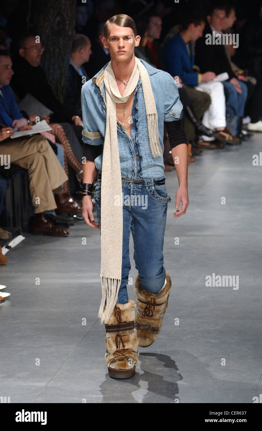 D&G Milan Menswear Ready to Wear Autumn Winter Long scarf, denim shirt and  denim pants tucked into ugg boots Stock Photo - Alamy