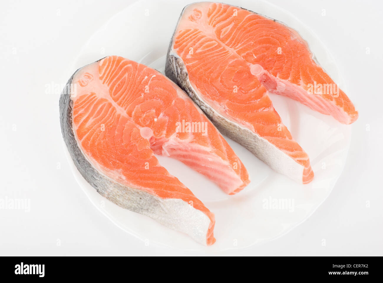 Red fish steak isolated on a white background Stock Photo - Alamy