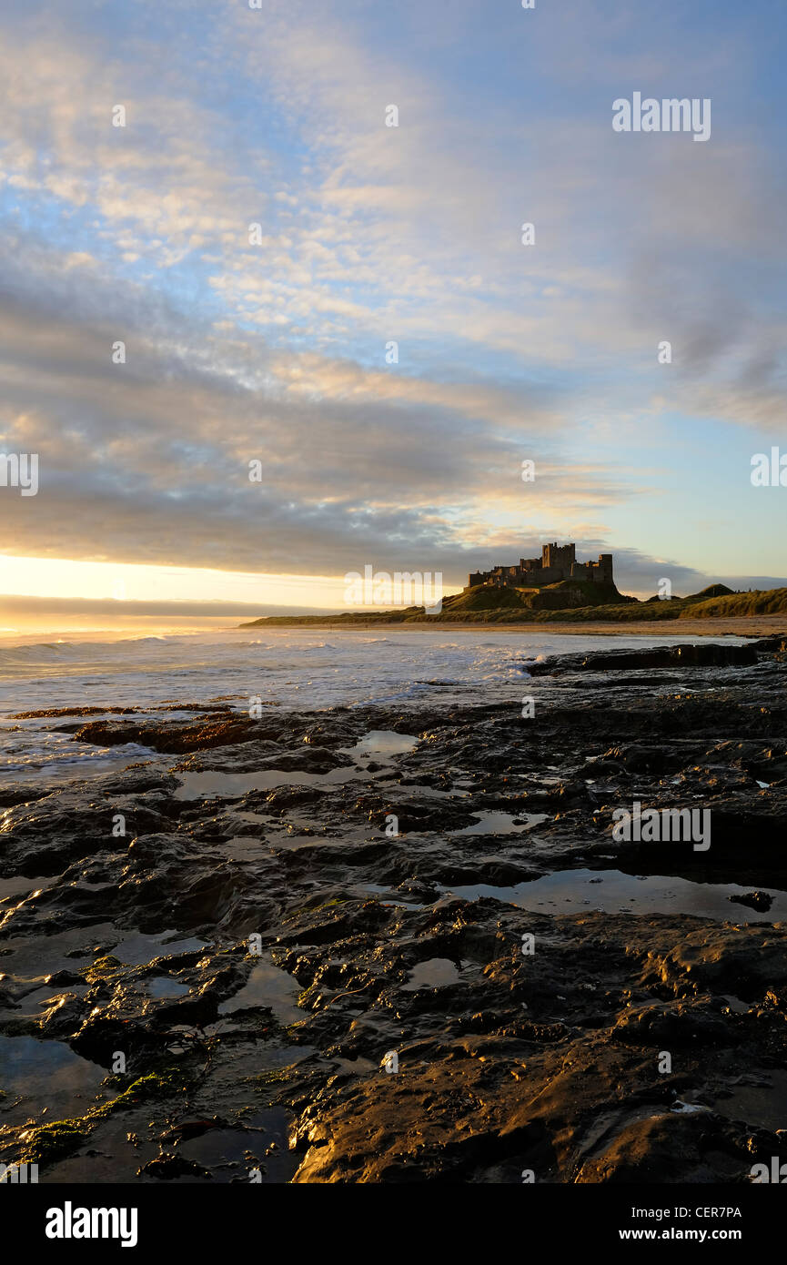 bamburgh beach and castle at dawn (portrait format) Stock Photo