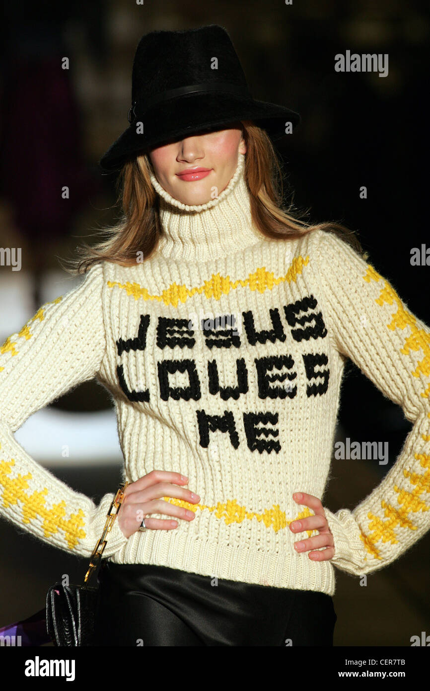 Dsquared Milan Ready to Wear Autumn Winter Trilby hat and knitted sweater  with 'Jesus Loves Me' slogan Stock Photo - Alamy