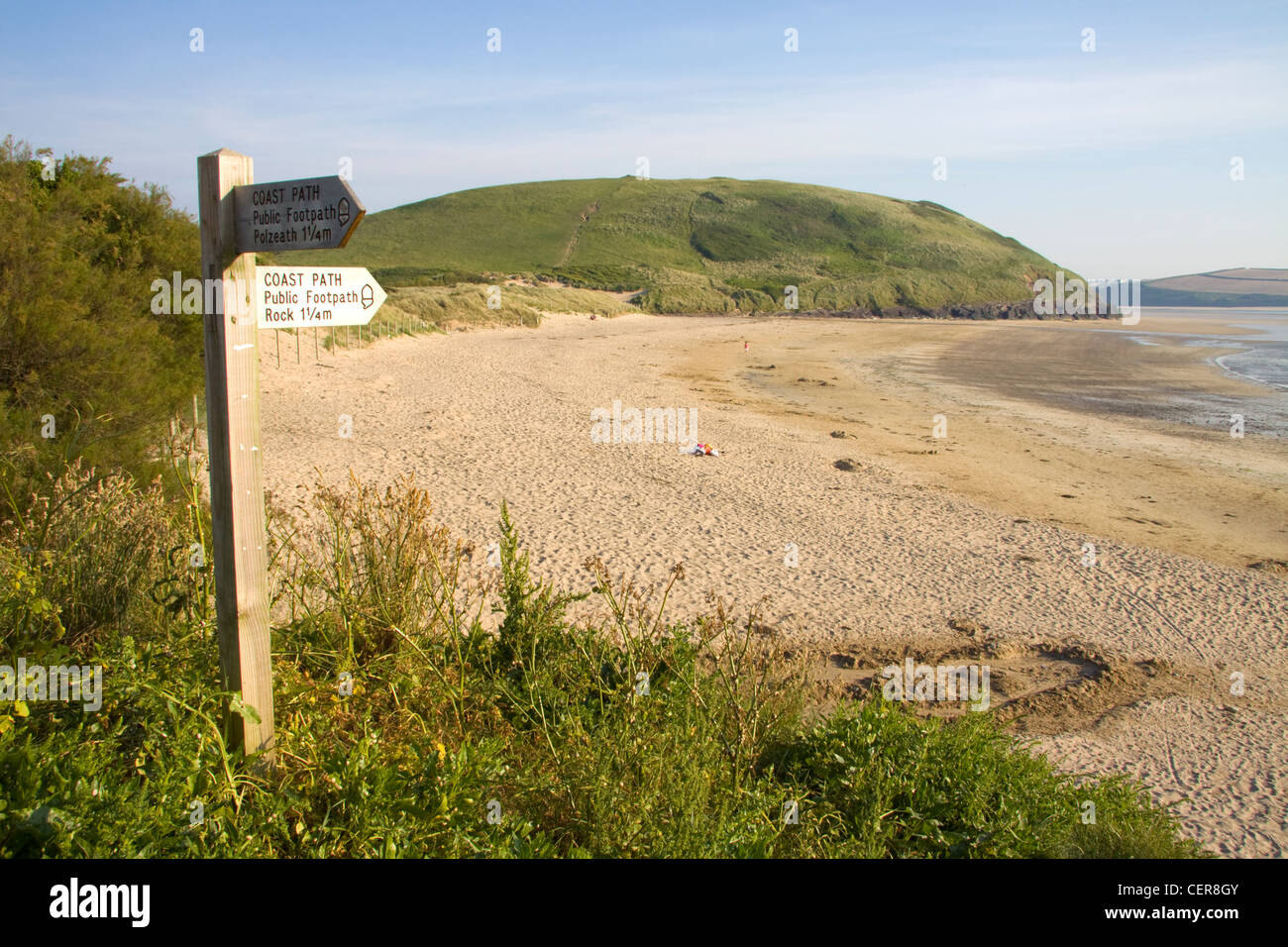 A coast path directional signpost at Daymer Bay near Trebetherick in north Cornwall. Stock Photo