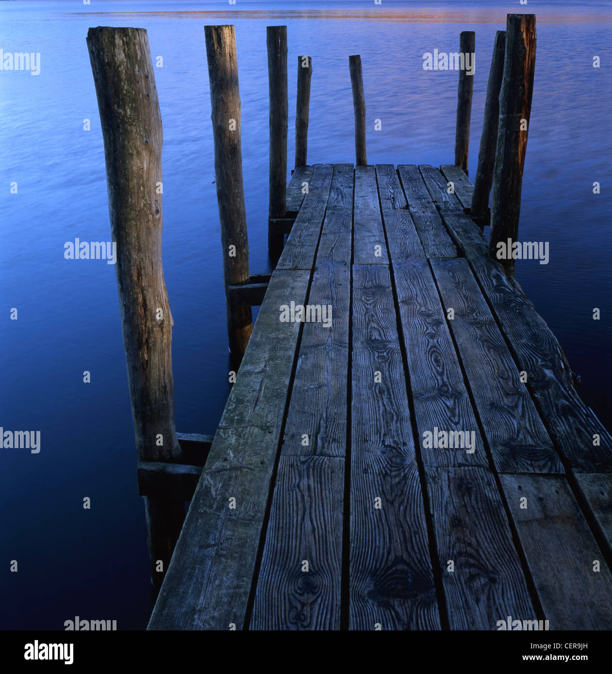 An old jetty at Brandlehow on the shores of Derwent Water near Keswick. Derwent Water is one of the principal bodies of water in Stock Photo