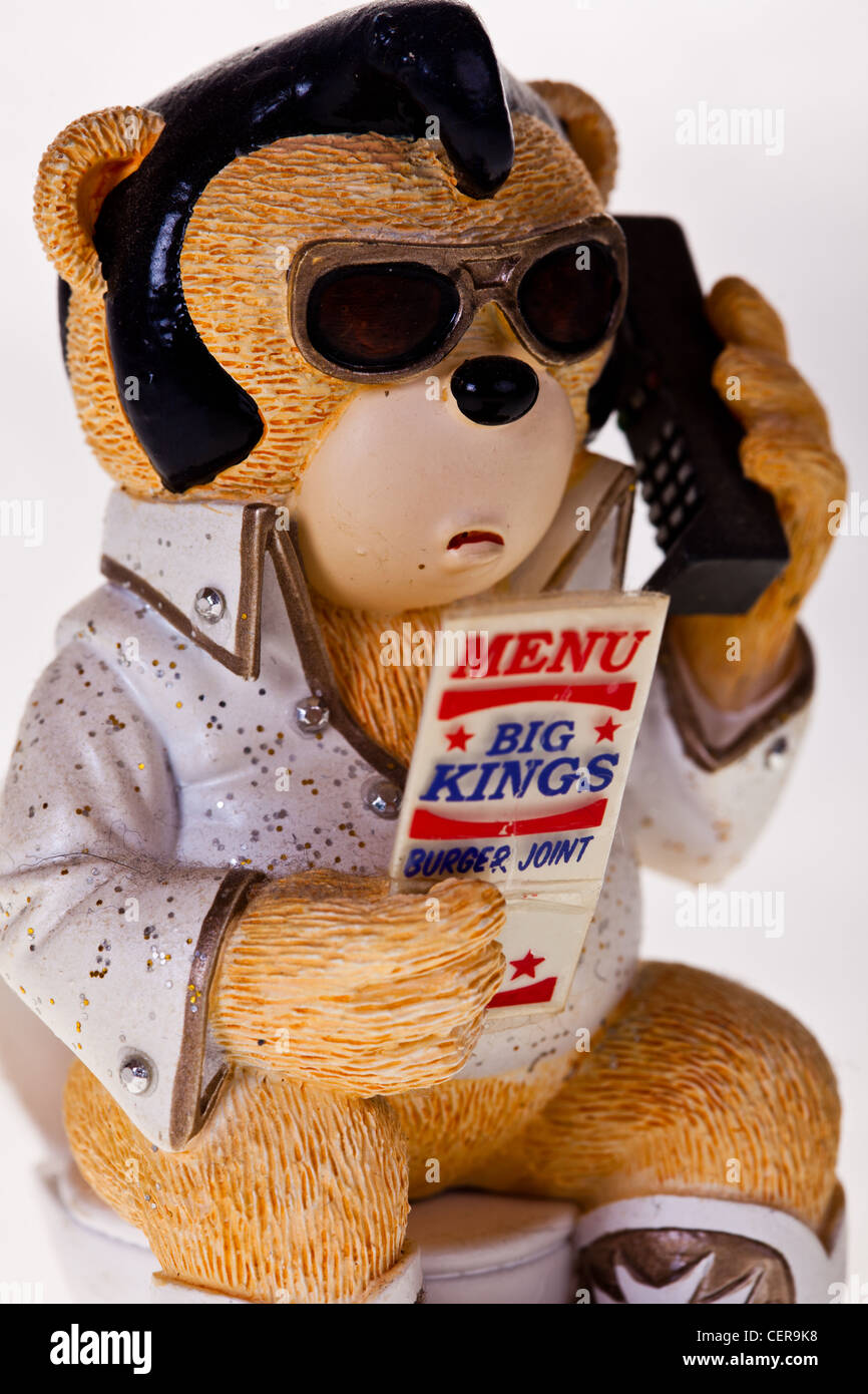 caricature bear as elvis sitting on toilet ordering a burger Stock Photo