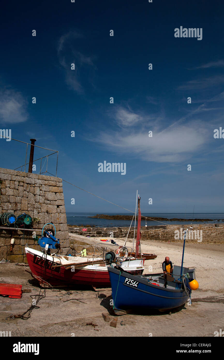 Picturesque harbor in Cornwall with the boats in dry dock waiting for the tide to turn to go back to sea and fishing Stock Photo