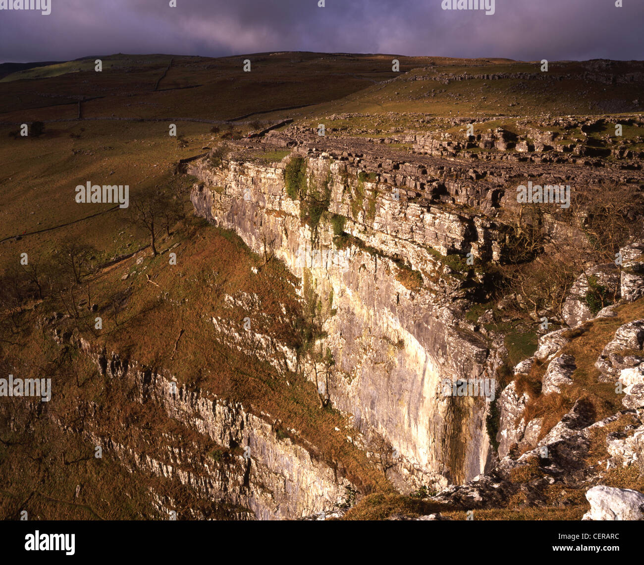 The impressive limestone cliffs at Malham Cove. They are one of the scenic wonders of England. Stock Photo